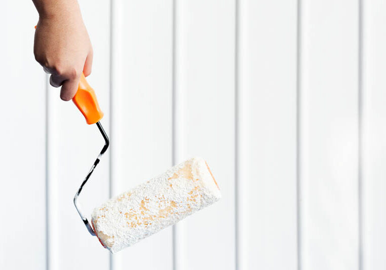 two-hands-painting-wall